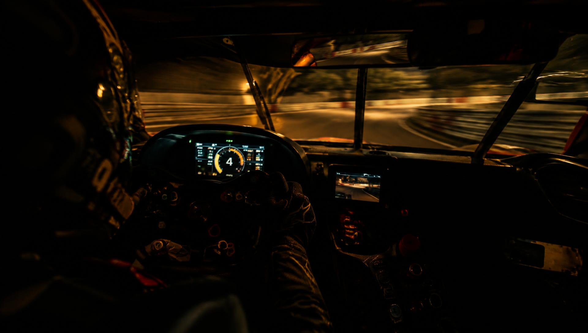View from inside a race car cockpit at speed